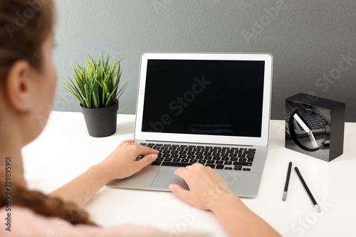 Woman working with laptop at home. Mock up with space for text