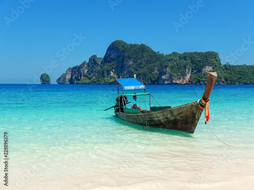 Longtail boat anchored at Ao Yongkasem beach on Phi Phi Don Island, Krabi Province, Thailand