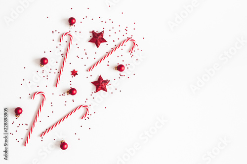 Christmas composition. Red decorations on white background. Christmas, winter, new year concept. Flat lay, top view, copy space