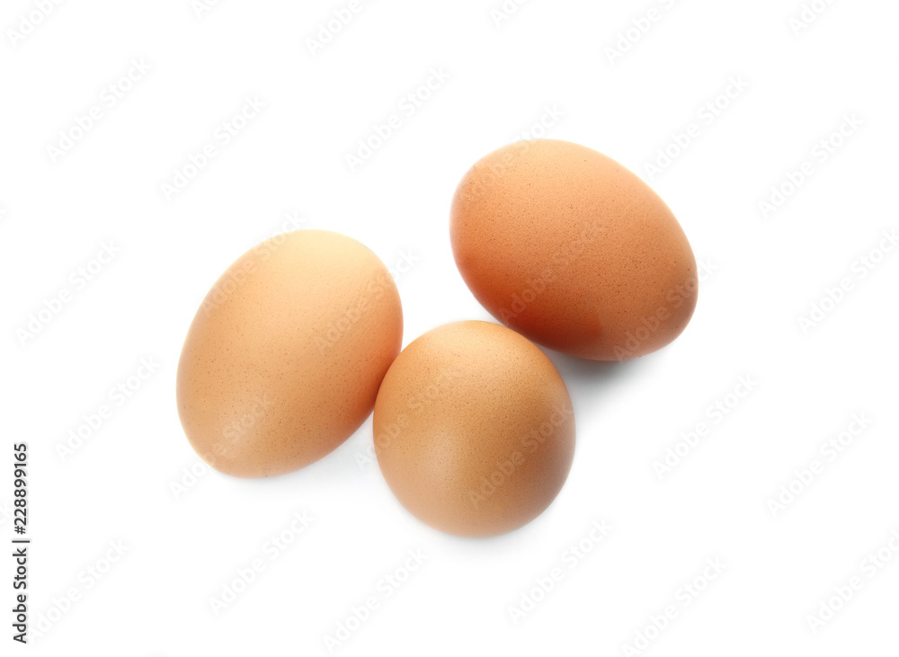 Few raw chicken eggs on white background Few raw chicken eggs on white background
