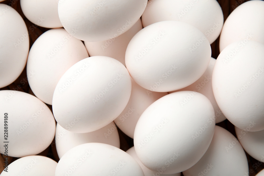 Pile of raw white chicken eggs, top view Pile of raw white chicken eggs, top view