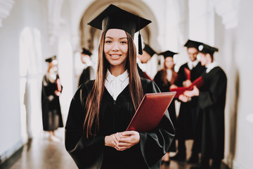 Asian Girl. Standing. Corridor. University. Robes.