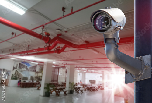 Security CCTV camera installed indoor. Intelligent cameras can record video all day and night to keep you safe from thieves. Surveillance Anti-theft system.