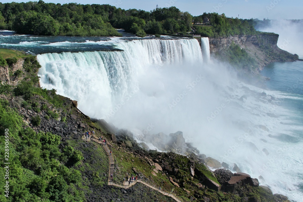 Niagara falls, American falls on a sunny, summer day taken from the observation tower Niagara falls, American falls on a sunny, summer day taken from the observation tower