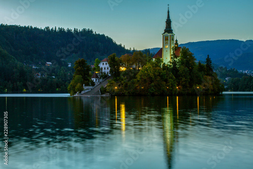 Beautiful mountain lake Bled . Pilgrimage Church of the Assumption of Maria situated on an island . Mountains in background. Slovenia, Europe. European travel.