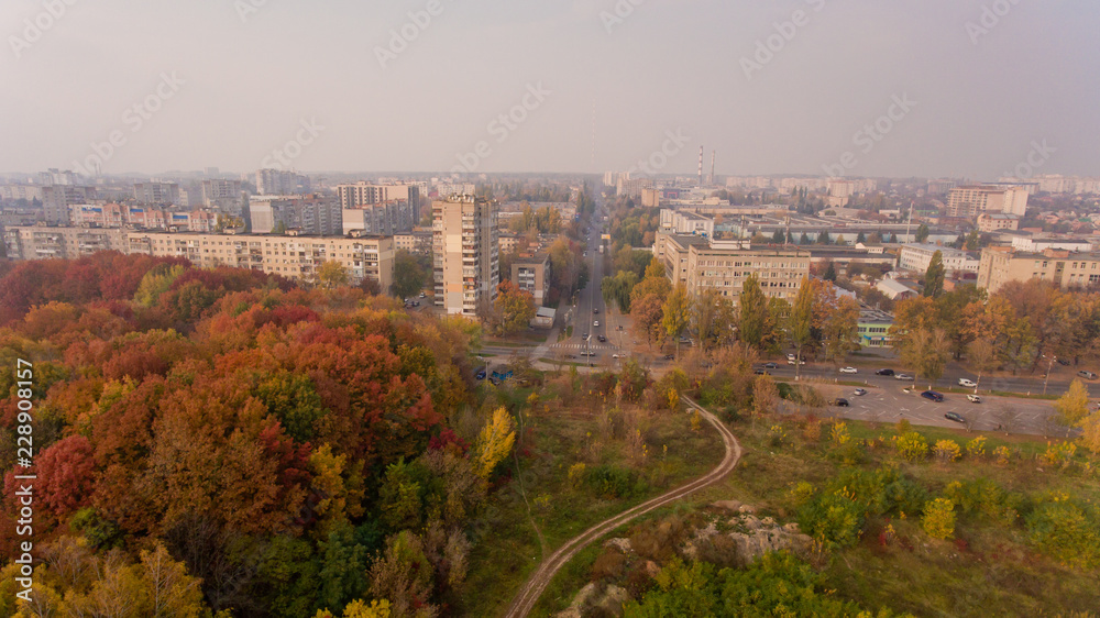 Aerial view of the colorful autumn city. Beautiful view of urban and nature.