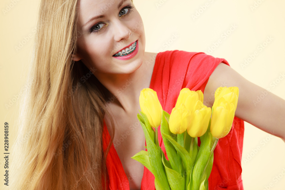 Pretty woman with yellow tulips bunch Pretty woman with yellow tulips bunch