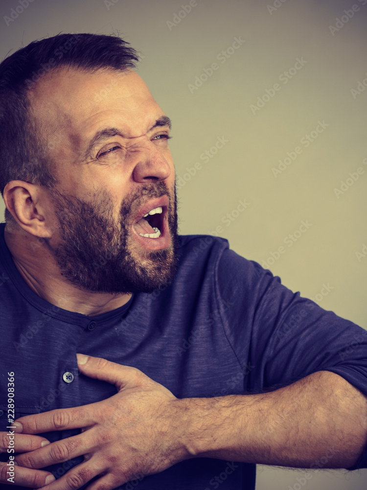 Obraz premium Man having heart pain attack