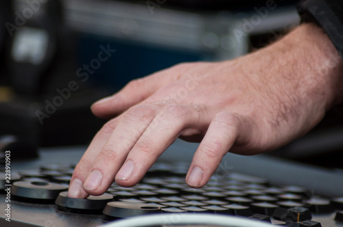 closeup of hands of mixer at concert in outdoor