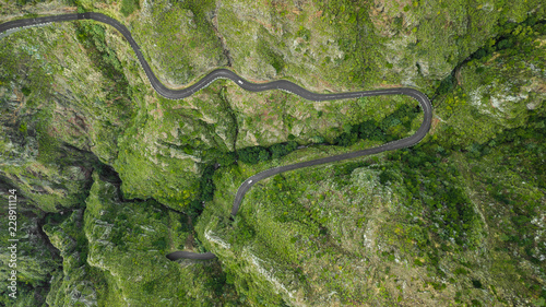 drone top view bended road on mountain of Paul do Mar, Madeira island, Portugal