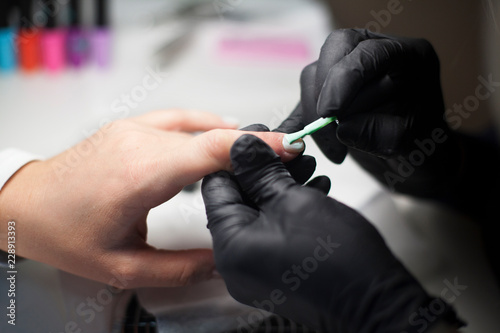 Manicure. Close-up Of Female Hands Filing Nails With Nail File In Beauty Salon. Nail Care Tool. High Resolution