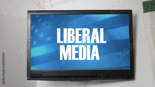 A TV displaying message about liberal media photo