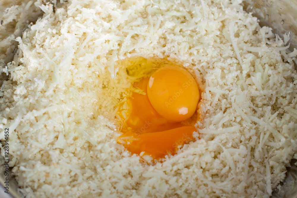 Preparation of paleo cauliflower pizza with ham Preparation of paleo cauliflower pizza with ham