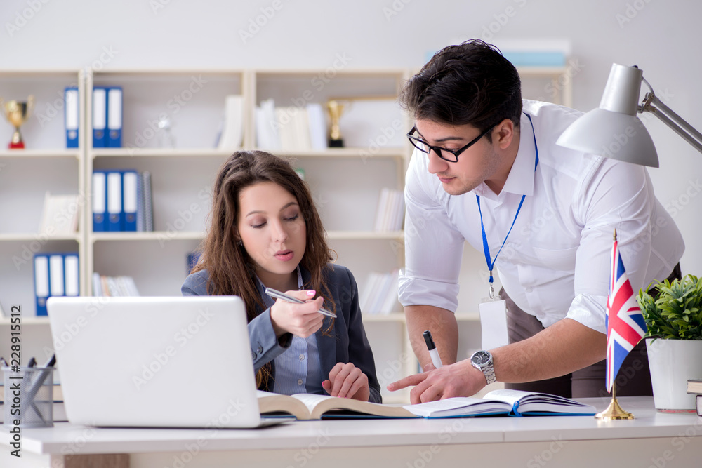 Teacher explaining to student at language training Teacher explaining to student at language training