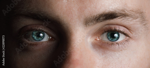 Surreal male green eyes photo