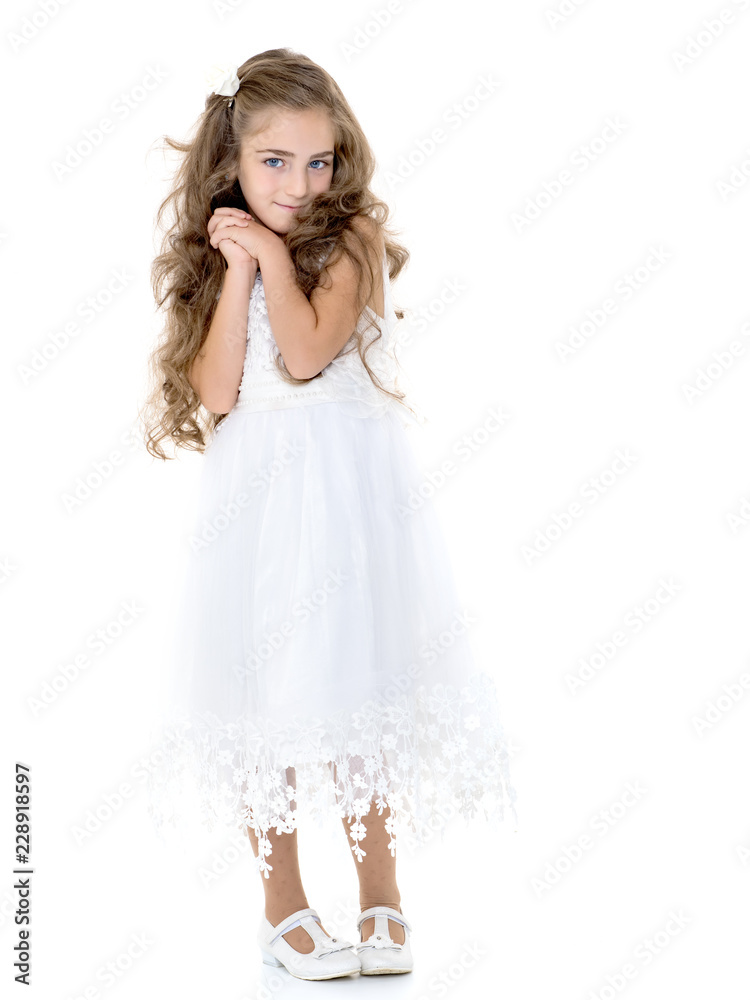 The little girl folded her hands around her face. The little girl folded her hands around her face.