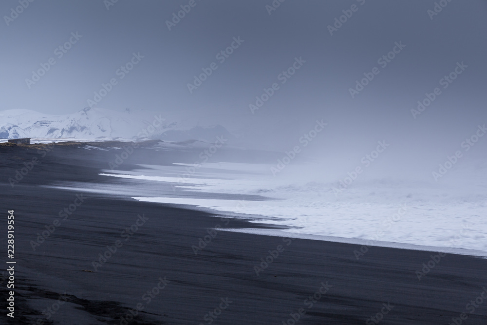 Waves Break on Black Sand Beach Vik Iceland