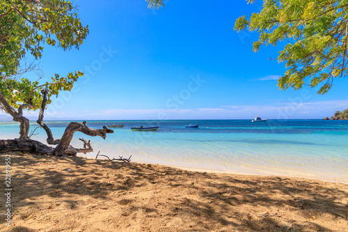Fototapeta Naklejka Na Ścianę i Meble -  Caribbean beach with fishing boats at Playa la Ensenada, Dominican Republic