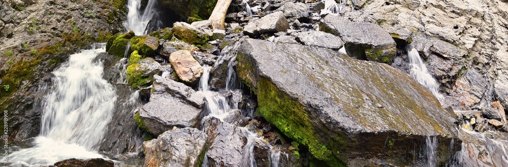 Waterfall and river stream Mountain views from hiking trails to Doughnut Falls in Big Cottonwood Canyon, in the Wasatch front Rocky Mountains, Utah, Western USA. Waterfall and river stream Mountain views from hiking trails to Doughnut Falls in Big Cottonwood Canyon, in the Wasatch front Rocky Mountains, Utah, Western USA.