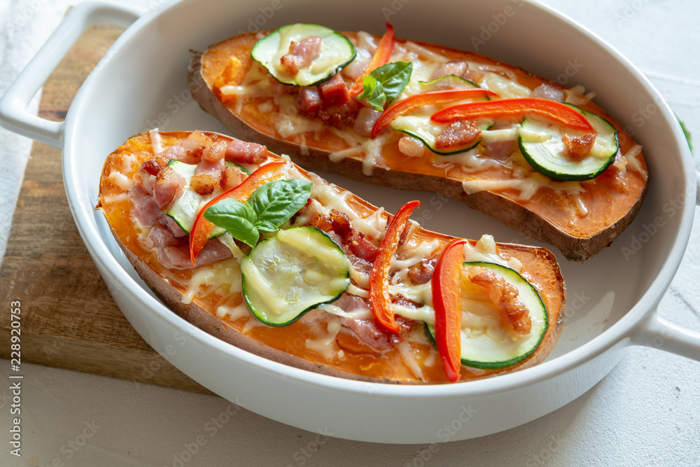 Baked sweet potato with bacon, sour cream, zucchini, red pepper and cheddar cheese. Baked sweet potato with bacon, sour cream, zucchini, red pepper and cheddar cheese.
