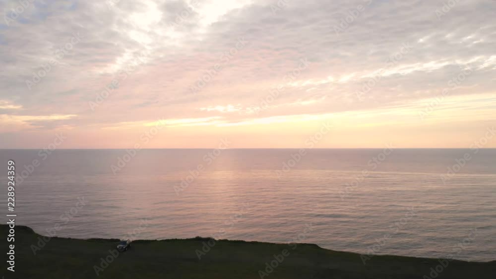 Aerial Dolly Of Ocean Cape And Beautiful Golden Sunset In The Evening Aerial Dolly Of Ocean Cape And Beautiful Golden Sunset In The Evening