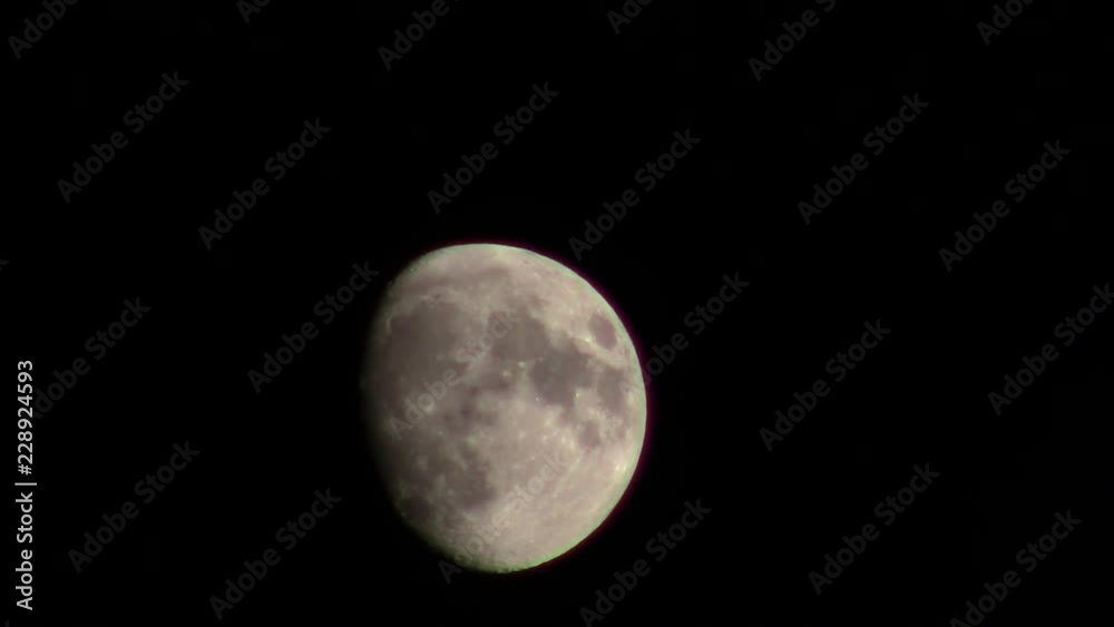 waxing gibbous moon in october with passing clouds waxing gibbous moon in october with passing clouds