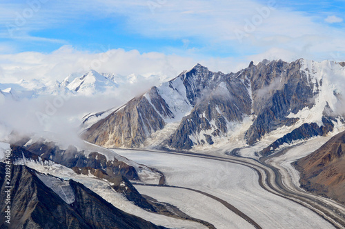 Kaskawulsh Glacier and Mountains in Clouds, Kluane National Park, Yukon photo