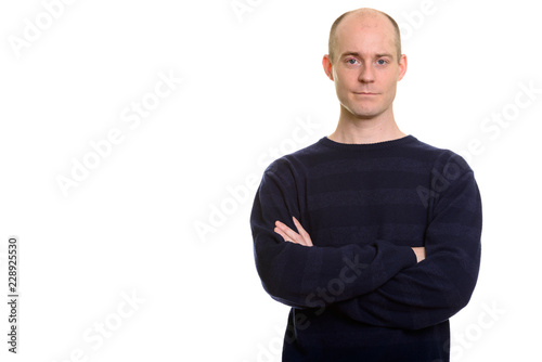 Bald Caucasian man with arms crossed looking © Ranta Images