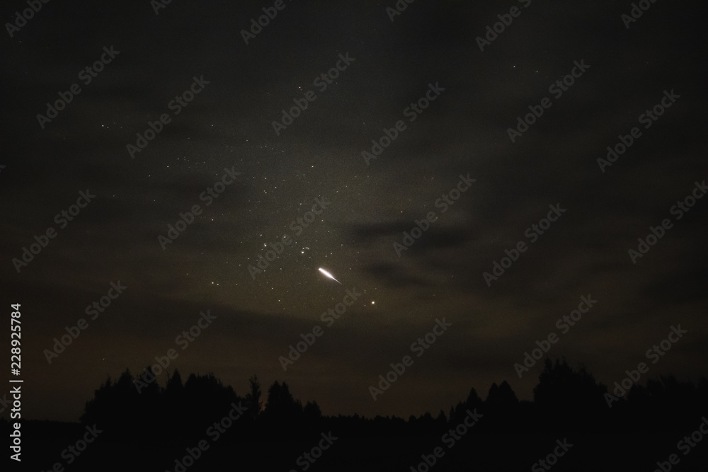 Starry sky through the clouds