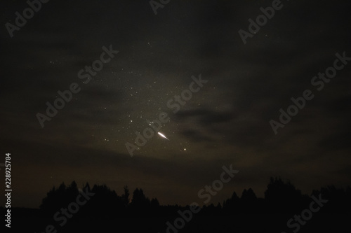 Starry sky through the clouds