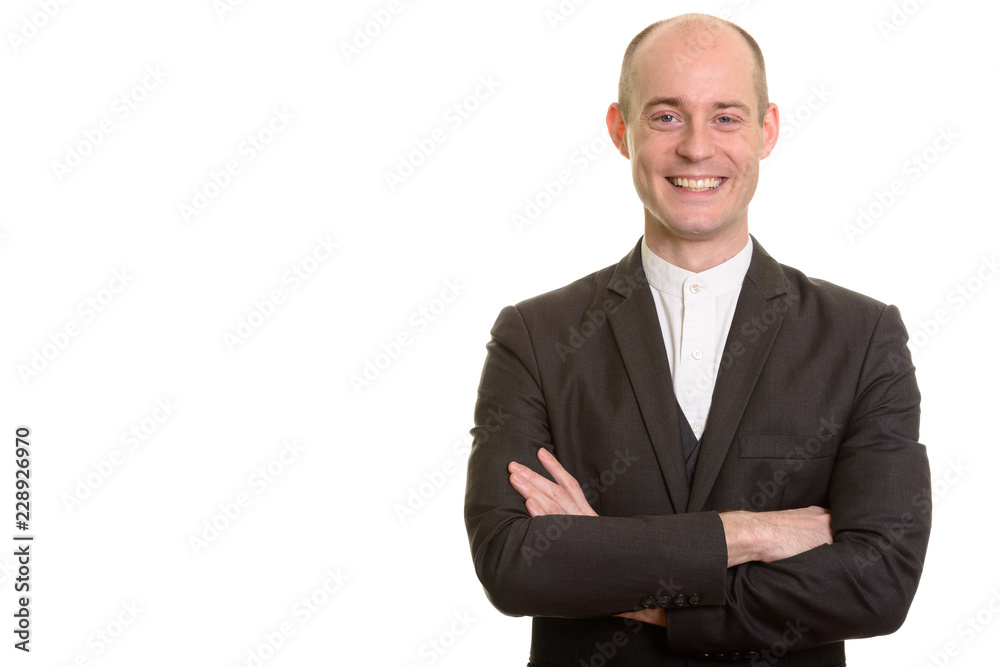 Happy bald Caucasian businessman smiling with arms crossed Happy bald Caucasian businessman smiling with arms crossed