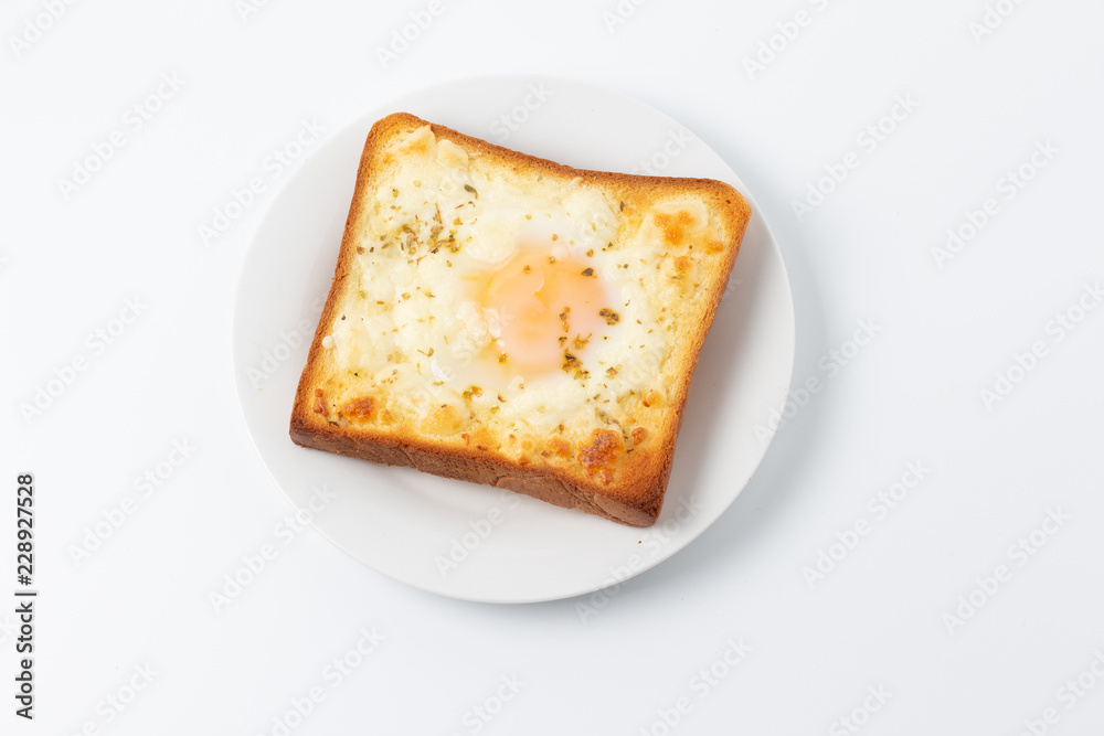 top view of breakfast with fried egg on toast, isolated on white