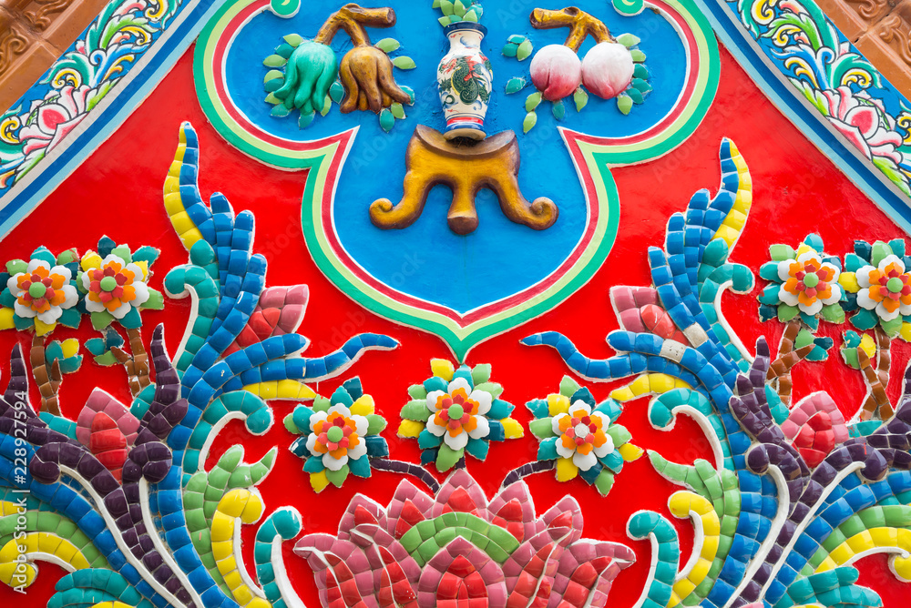 Beautiful detail of handmade Chinese style flower ceramic mosaic tile background in Chinese temple Beautiful detail of handmade Chinese style flower ceramic mosaic tile background in Chinese temple