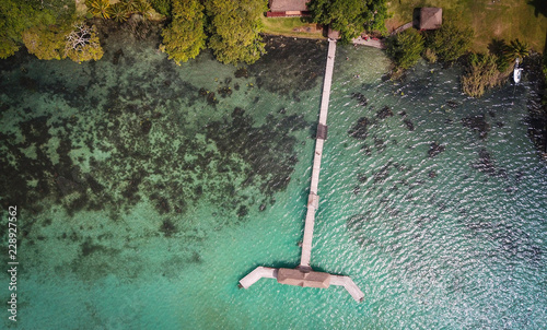 Drone shopp from above of wooden pier dock in beautiful  Mexican lagoon Baclar  photo