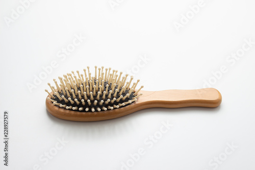 Top view Old wooden hairbrush on white background