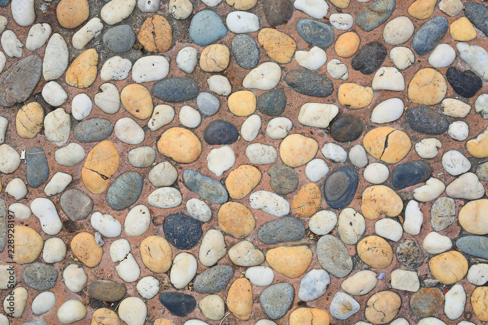 The abstract pattern of wall constructed with pebbles The abstract pattern of wall constructed with pebbles