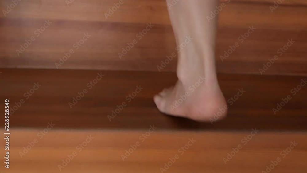 A girl goes down the village stairs to her first floor A girl goes down the village stairs to her first floor