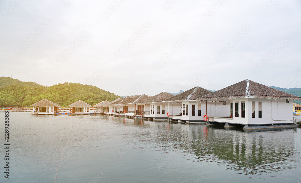 Raft House floating on the river with mountain at kanchanaburi, Resort in thailand.