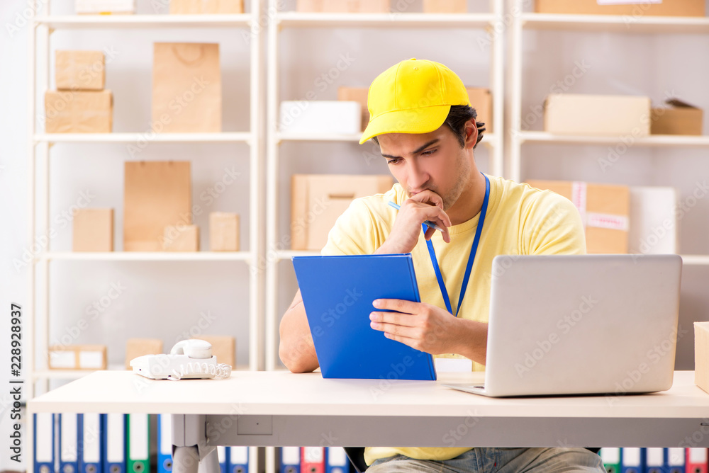 Handsome contractor working in box delivery relocation service 
