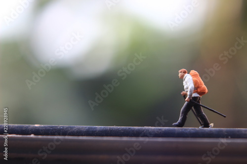 Single Mini Figure Hiker Walking at Easy Horizontal Track photo