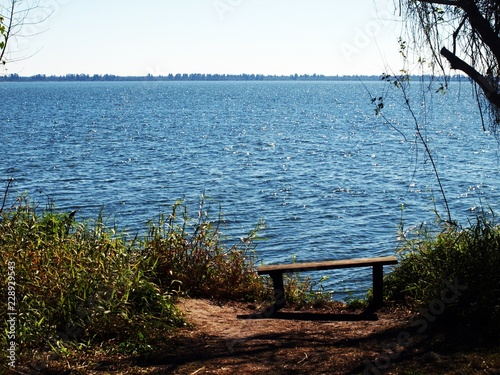 Bench on the lake shore © jojurkiewicz