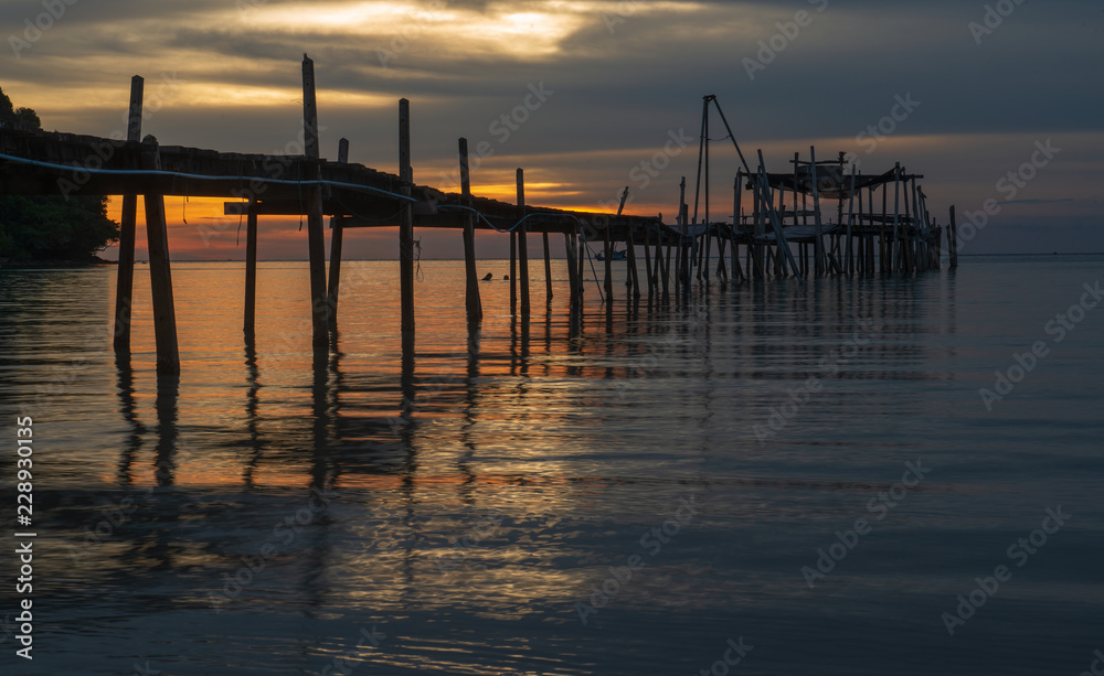 old wooden pier at sunset
