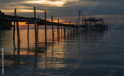 old wooden pier at sunset