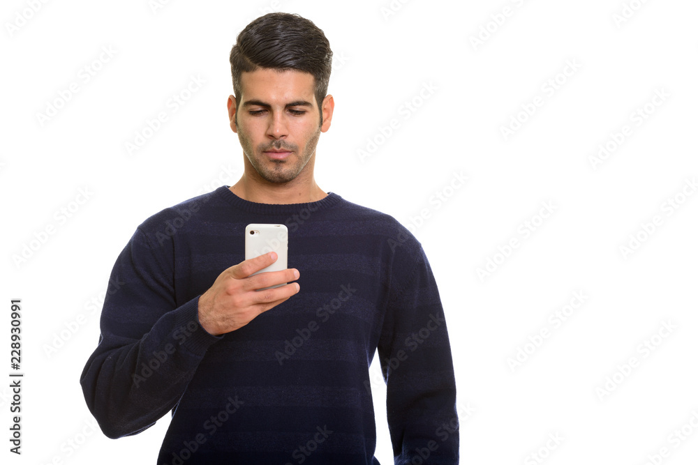Young handsome Persian man using mobile phone Young handsome Persian man using mobile phone