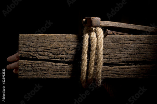 Фотография Rope on a wooden crossbeam