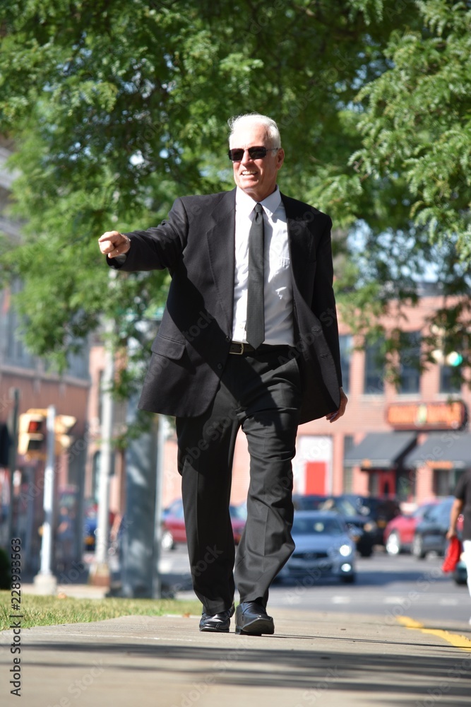 Political Candidate Pointing Wearing Tie Walking On Sidewalk Political Candidate Pointing Wearing Tie Walking On Sidewalk