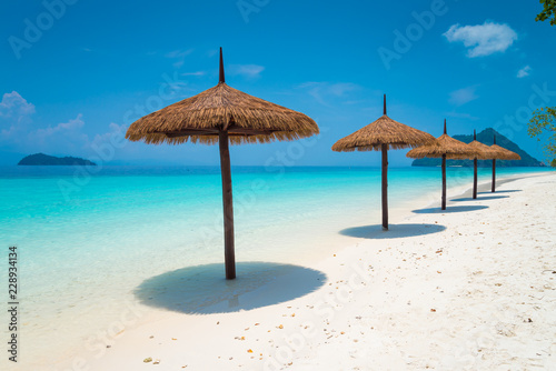 Beautiful tropical island white sand beach blue sky sunny day - Summer breeze holiday