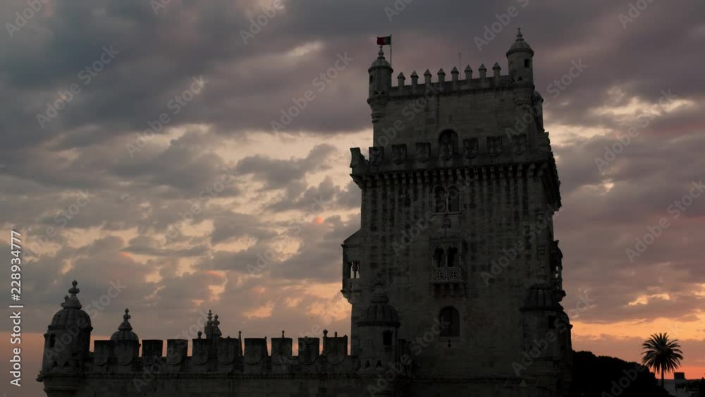 Belem tower is an ancient fort timelapse at sunset, Lisbon, Portugal Belem tower is an ancient fort timelapse at sunset, Lisbon, Portugal