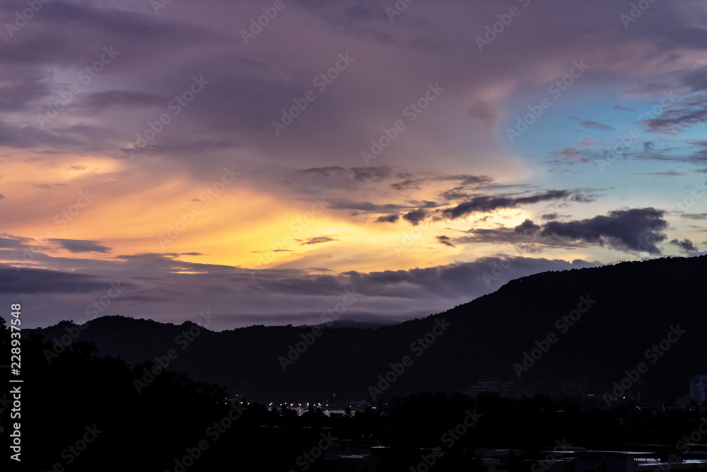 A dramatic sunrise over the city of Patong from the southern hillside.