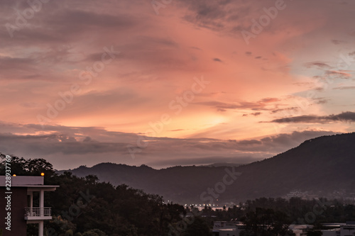 Obraz na płótnie A dramatic sunrise over the city of Patong from the southern hillside. w salonie